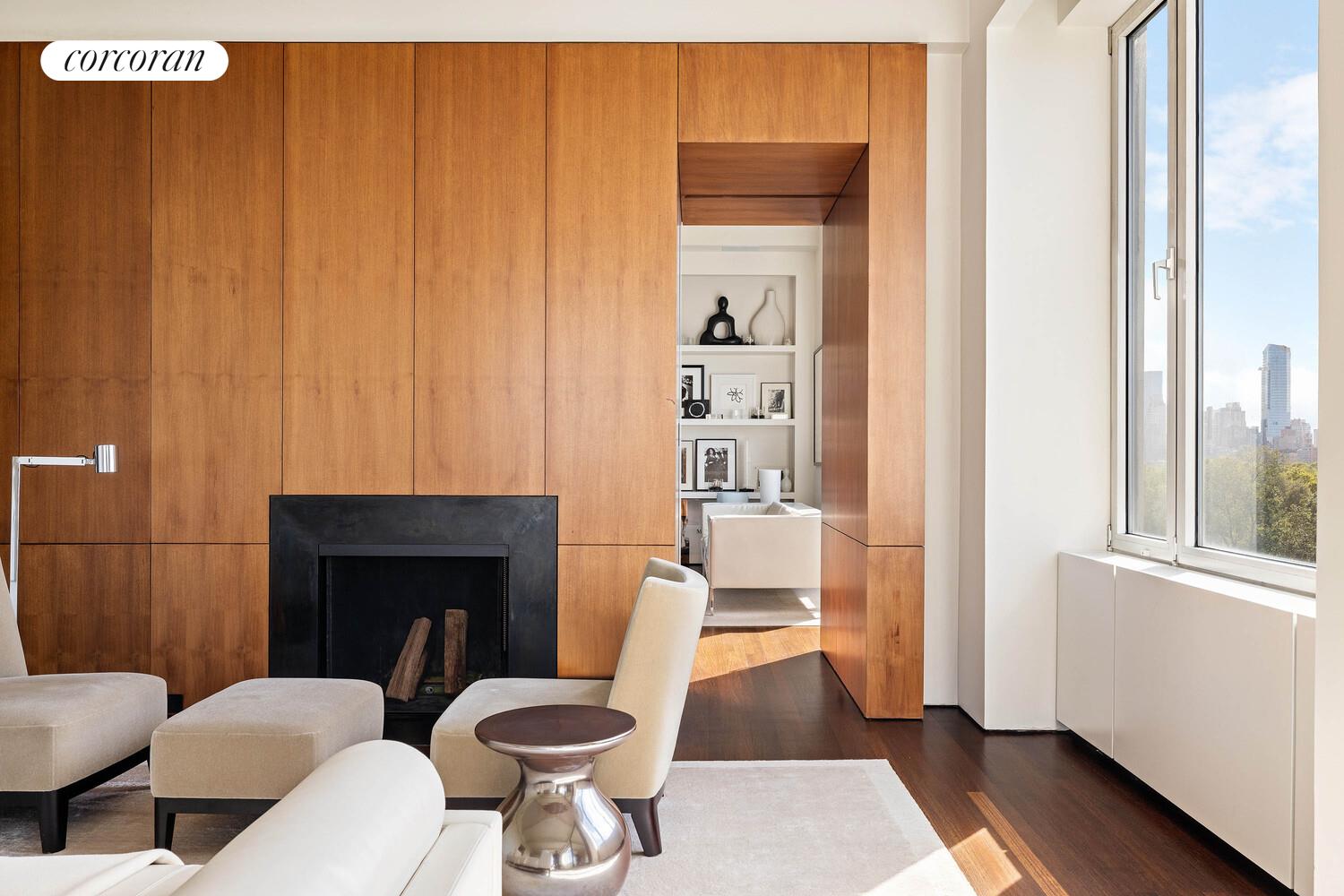 2 East 88th Street, Unit 10 Manhattan, NY 10128 - Photo 7 of 35 a living room with furniture a rug and a fireplace