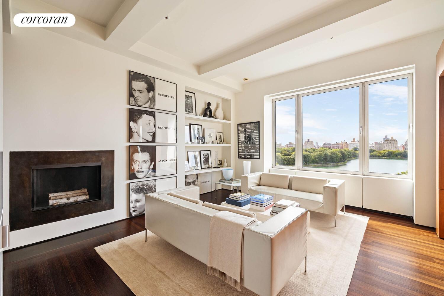 2 East 88th Street, Unit 10 Manhattan, NY 10128 - Photo 8 of 35 a living room with furniture and a fireplace