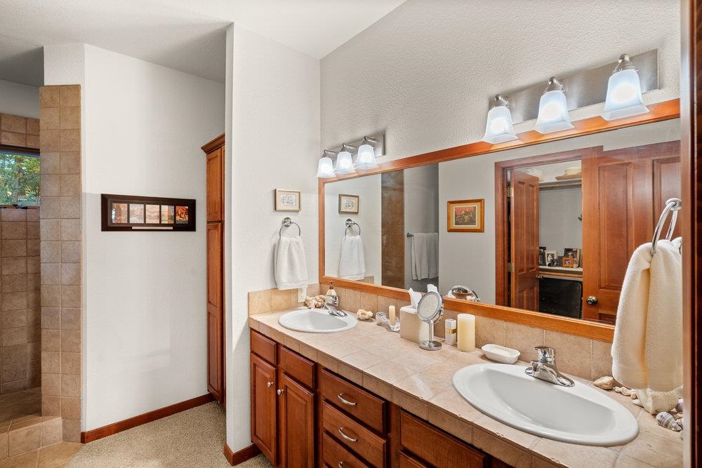 238 Clouds Rest Portola, CA 96122 - Photo 19 of 34 a bathroom with a sink double vanity and a mirror