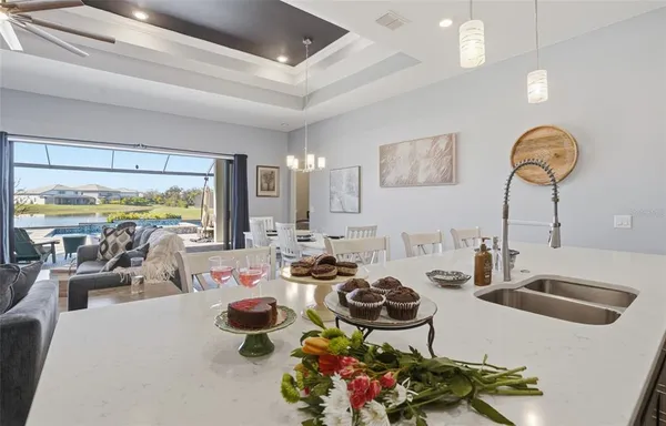 a view of kitchen with dining table and chairs