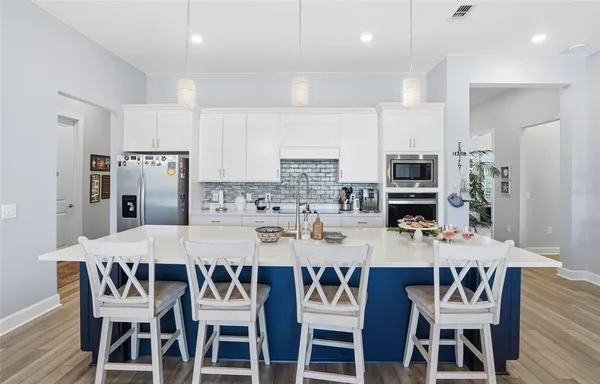 a kitchen with a sink and cabinets