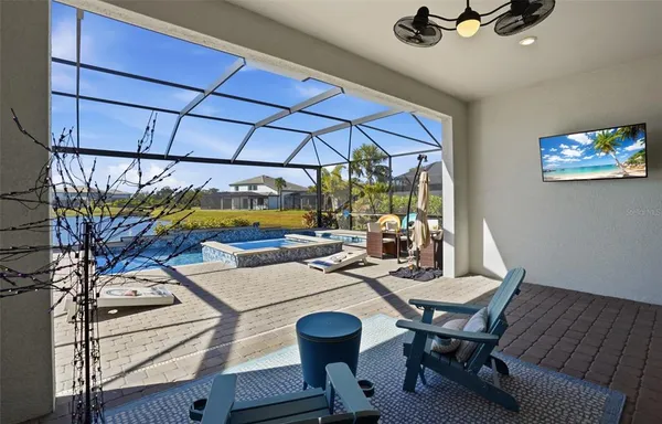 a view of a swimming pool with a patio