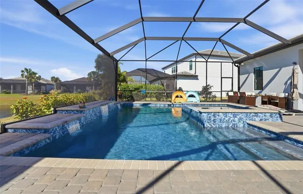 a view of a swimming pool with a patio