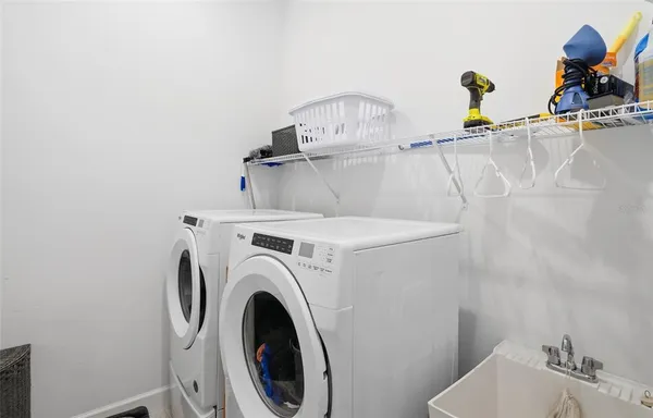 a view of table and chairs under an umbrella