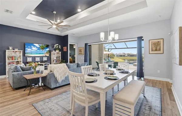 a living room with fireplace furniture and a flat screen tv