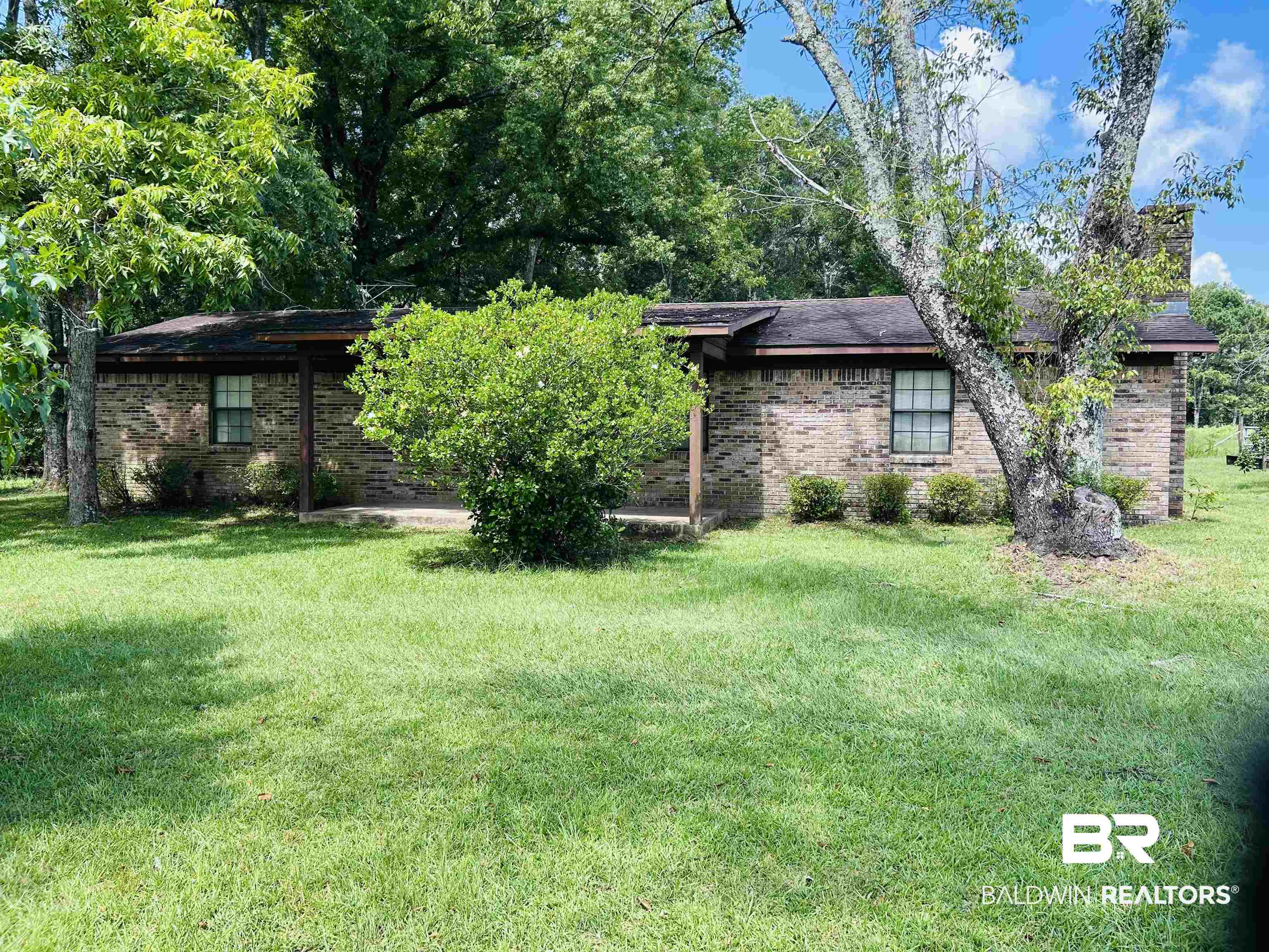1350 A Schillinger Road South Mobile, AL 36695 - Photo 1 of 18 View of green lawn