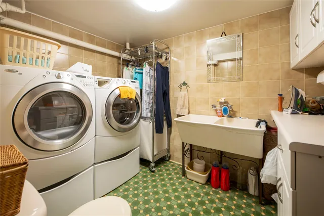 a utility room with dryer and washer