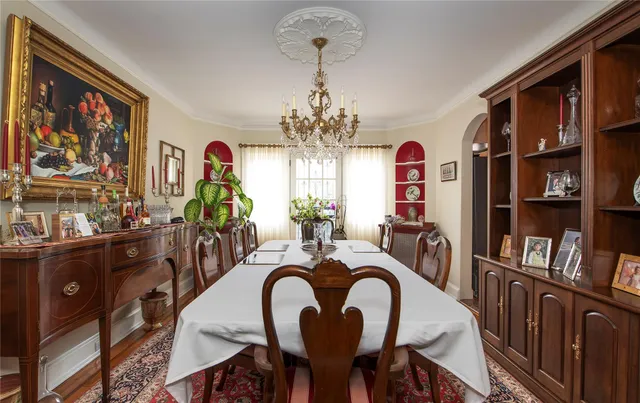 a view of a dining room with furniture kitchen and wooden floor
