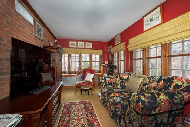 a bed room with two beds and a large window