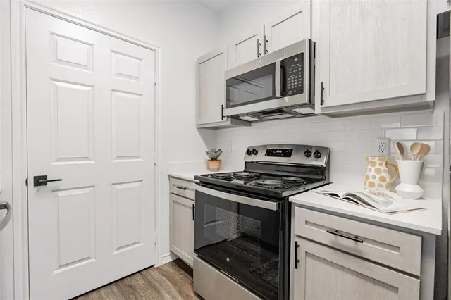 a kitchen with a sink and cabinets