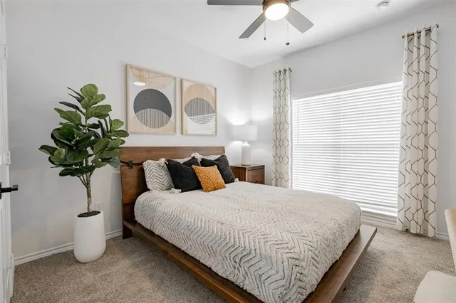 a kitchen with a sink and a wooden floor