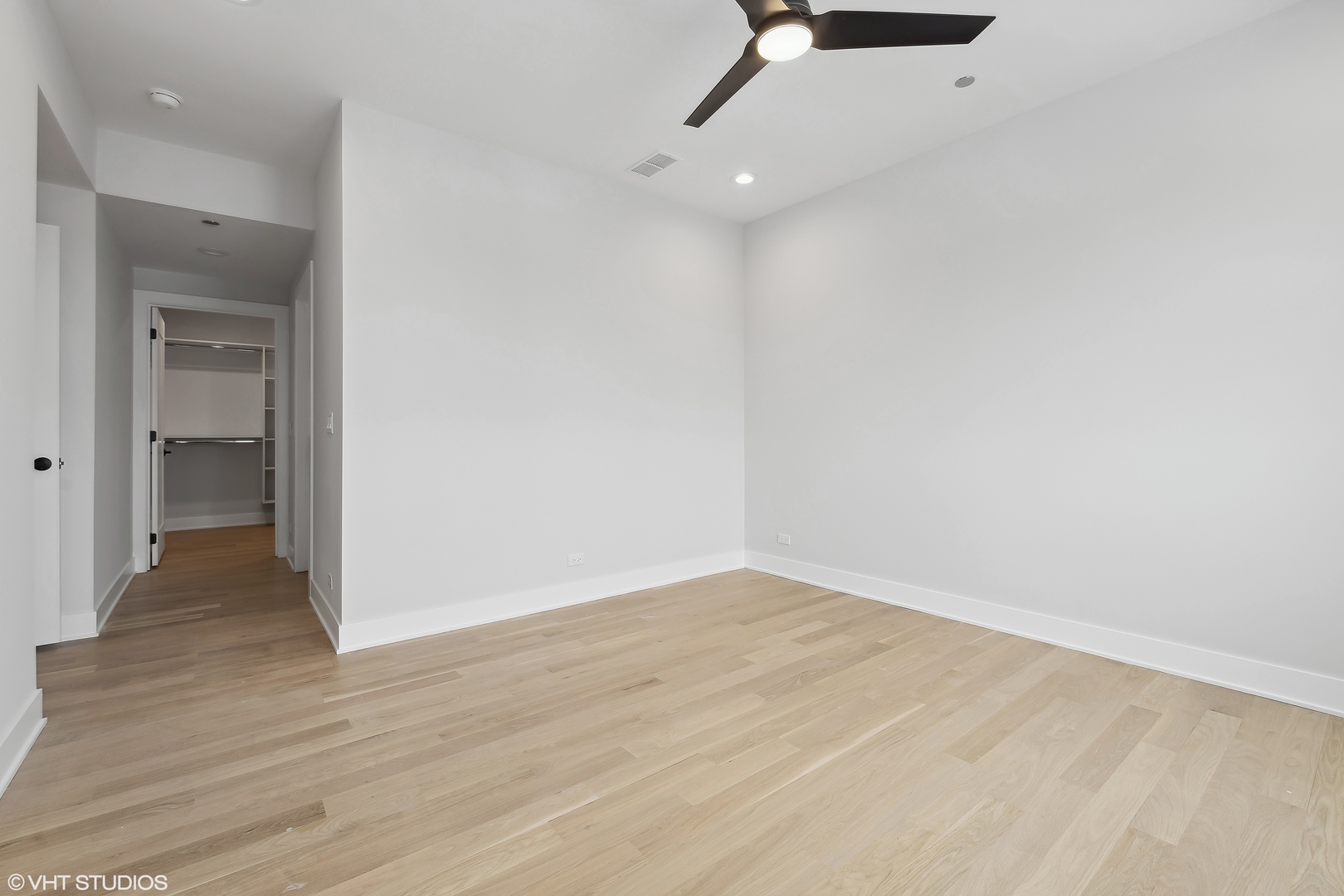 4537 North Clark Street, Unit 4D Chicago, IL 60640 - Photo 12 of 29 a view of an empty room with wooden floor