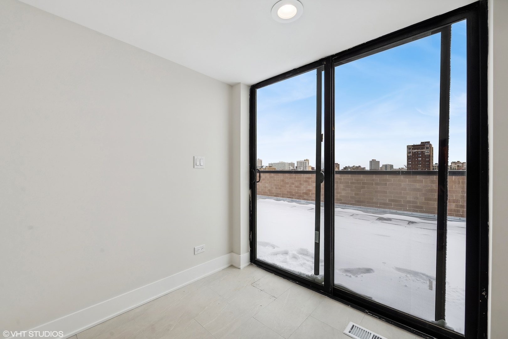 4537 North Clark Street, Unit 4D Chicago, IL 60640 - Photo 24 of 29 wooden floor in an empty room with glass door