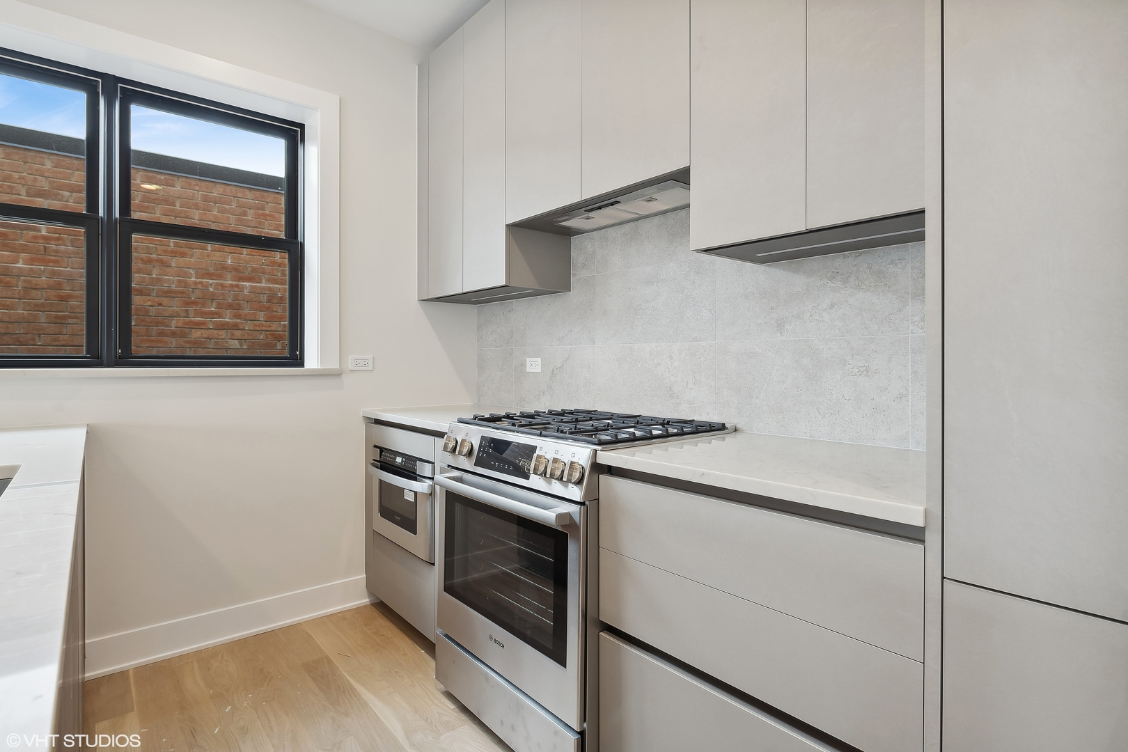 4537 North Clark Street, Unit 4D Chicago, IL 60640 - Photo 5 of 29 a white stove top oven sitting inside of a kitchen