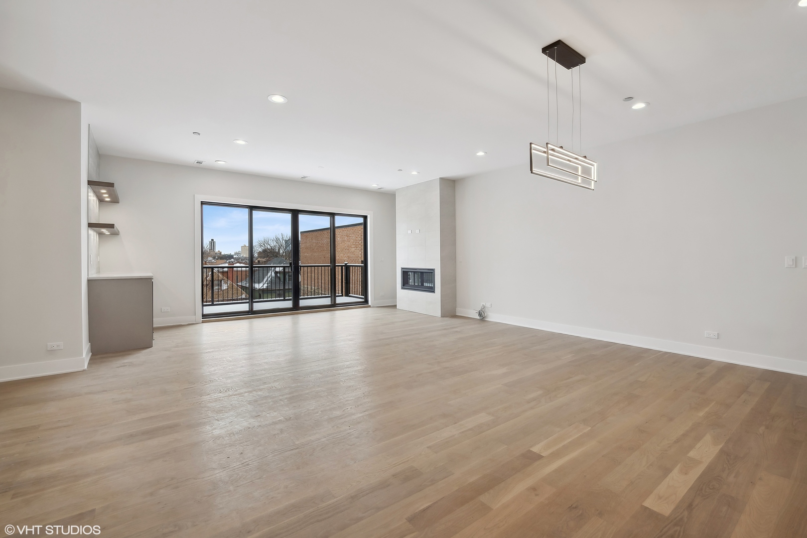 4537 North Clark Street, Unit 4D Chicago, IL 60640 - Photo 7 of 29 a view of an empty room with wooden floor and a window