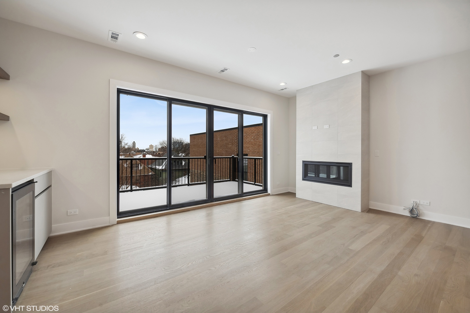 4537 North Clark Street, Unit 4D Chicago, IL 60640 - Photo 8 of 29 a view of a big room with windows and chandelier