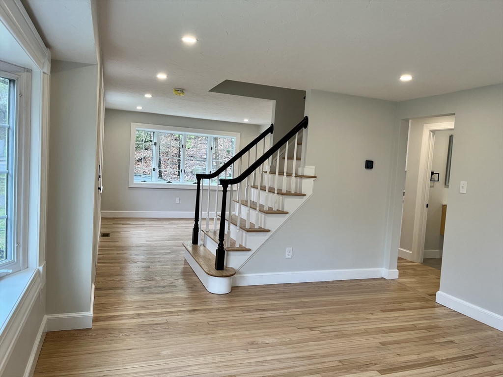 69 Brookside Road Braintree, MA 02184 - Photo 11 of 28 a view of entryway and hall with wooden floor