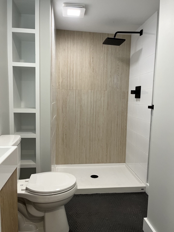 69 Brookside Road Braintree, MA 02184 - Photo 16 of 28 a bathroom with a sink a toilet and shower