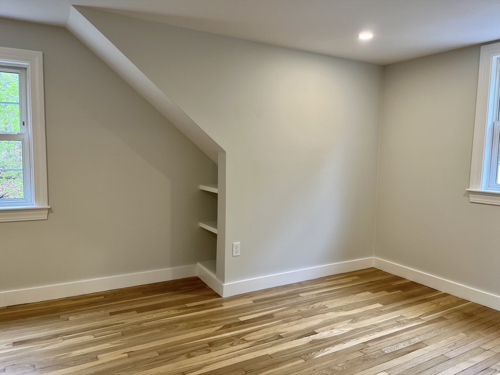 69 Brookside Road Braintree, MA 02184 - Photo 20 of 28 a view of empty room with wooden floor and fan