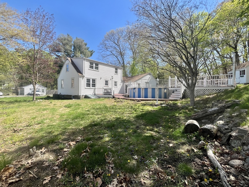 69 Brookside Road Braintree, MA 02184 - Photo 2 of 28 a house view with a sitting space and garden