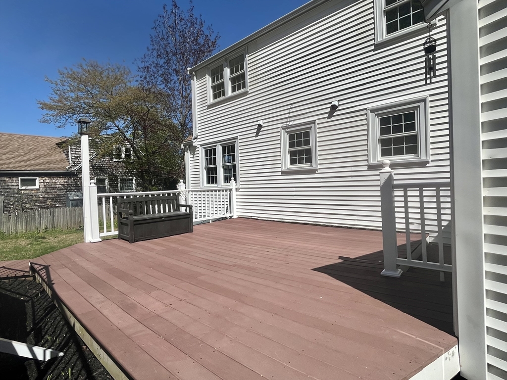 69 Brookside Road Braintree, MA 02184 - Photo 24 of 28 a view of a backyard with a deck