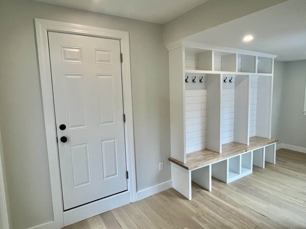 69 Brookside Road Braintree, MA 02184 - Photo 6 of 28 a view of a livingroom with wooden floor