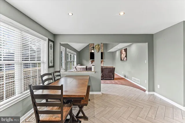 a view of a dining room with furniture window and outside view