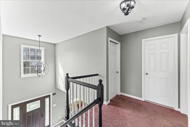 a view of a hallway with windows