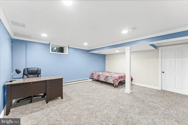 a bedroom with a workspace