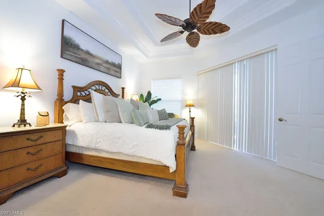 a bed room with a bed and a chandelier