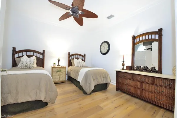 a bedroom with bed and window