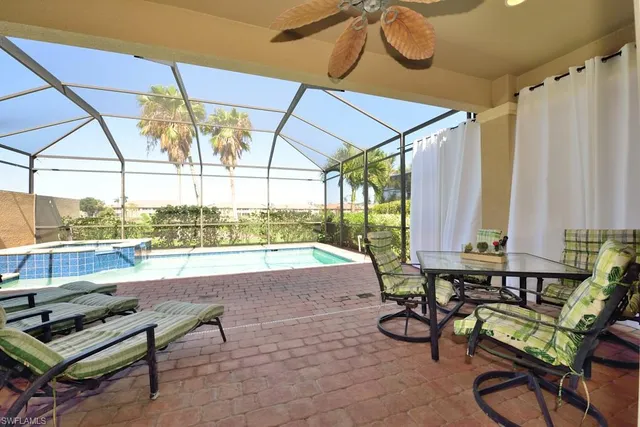 a building outdoor space with patio furniture and potted plants