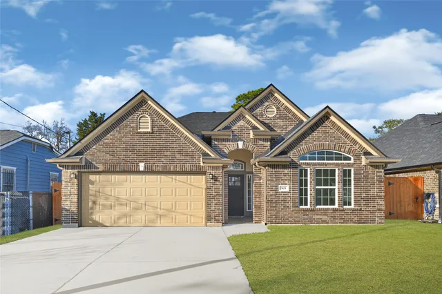 front view of a house with a yard