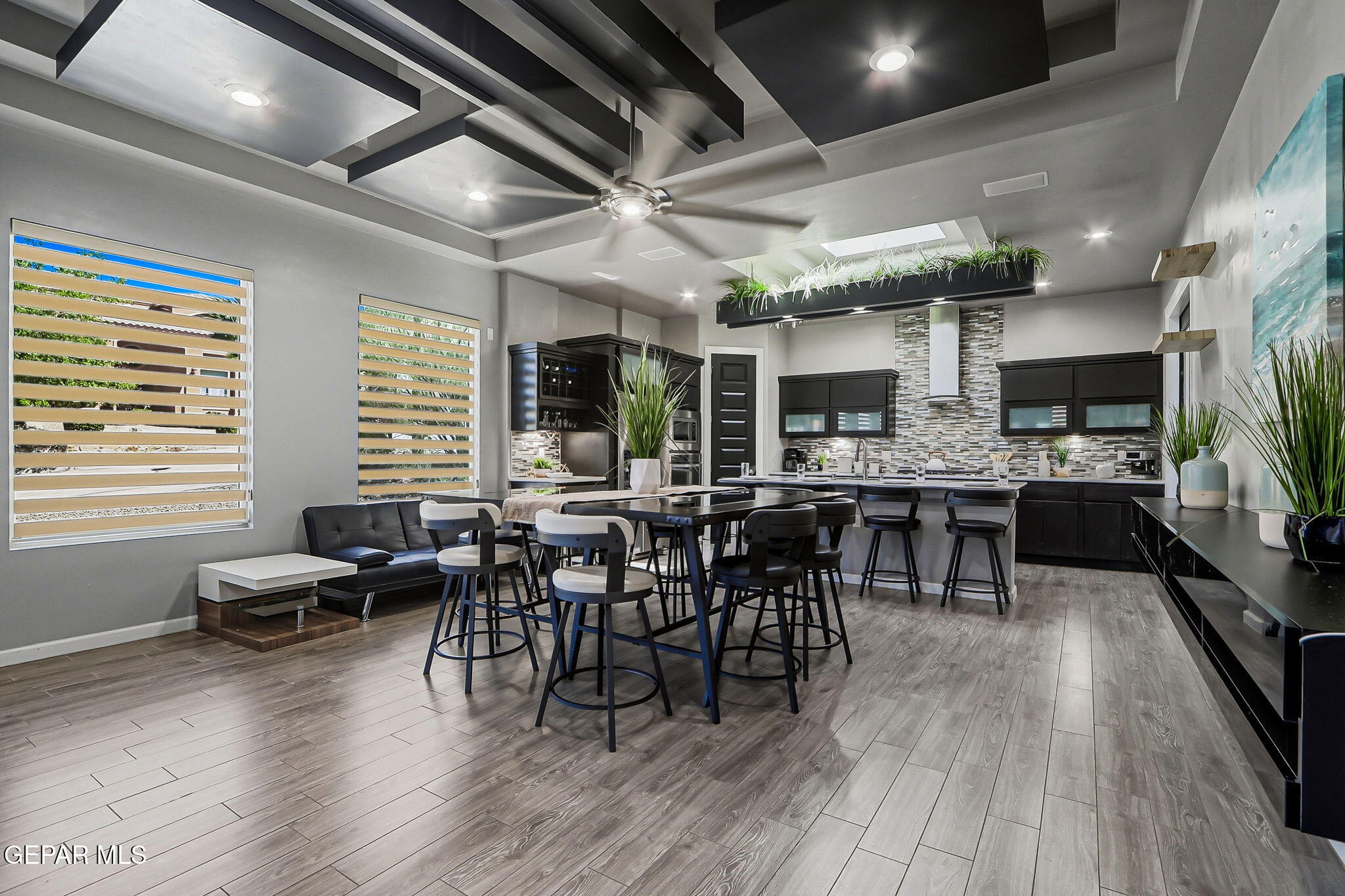 5812 Sundale Road El Paso, TX 79912 - Photo 16 of 47 a view of a dining room with furniture window and wooden floor