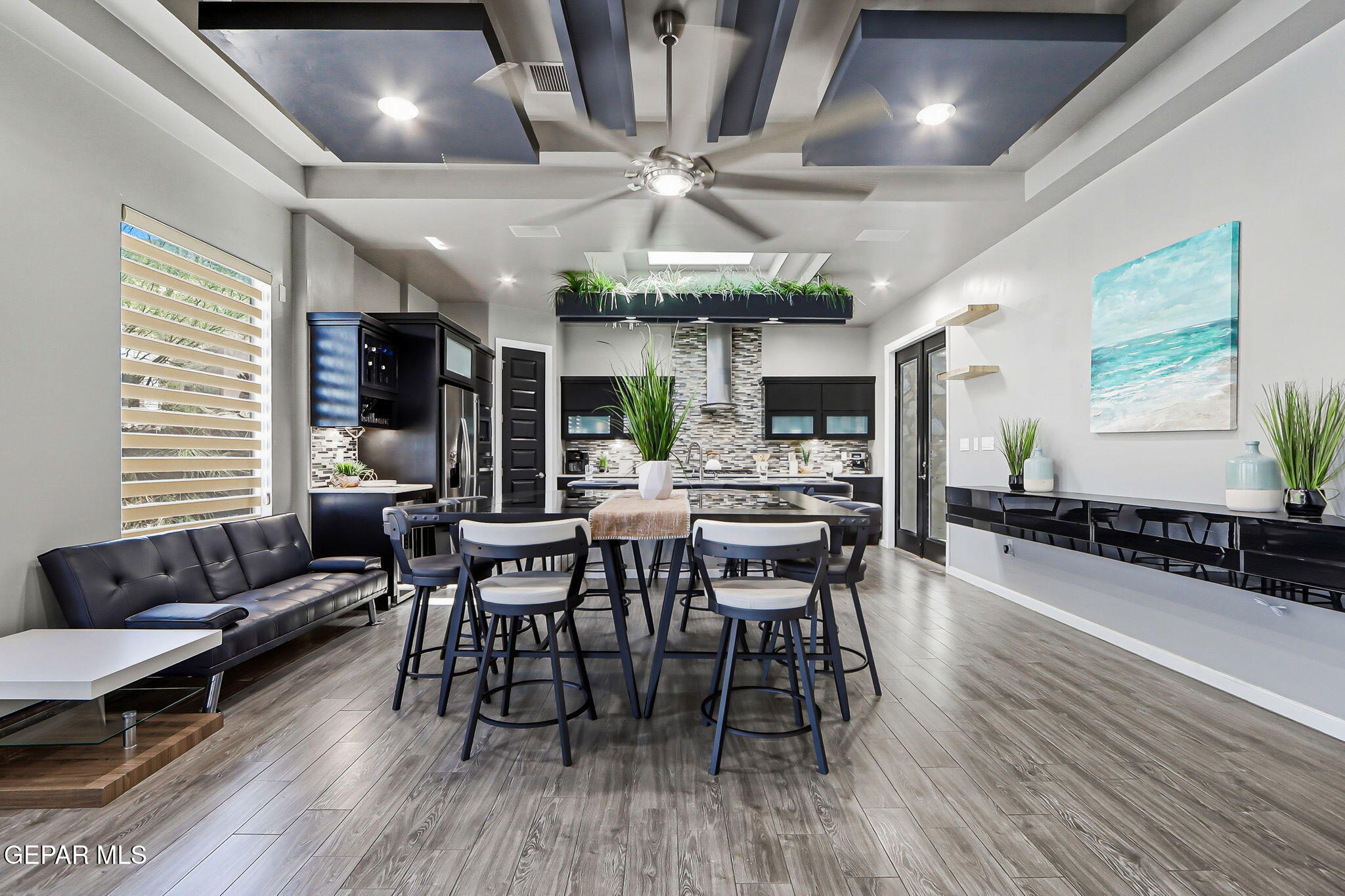 5812 Sundale Road El Paso, TX 79912 - Photo 17 of 47 a view of a dining room with furniture window and wooden floor