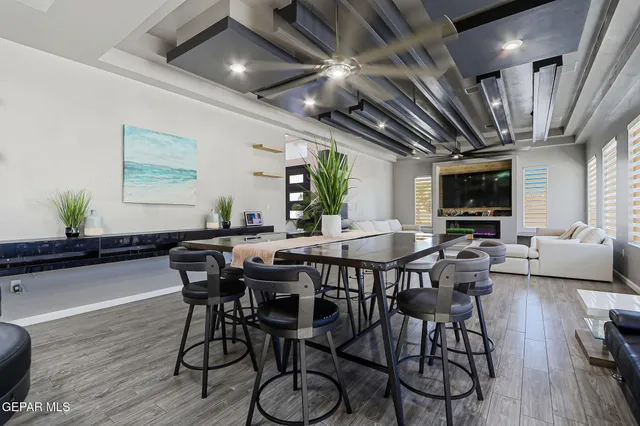 a view of a dining room with furniture window and wooden floor