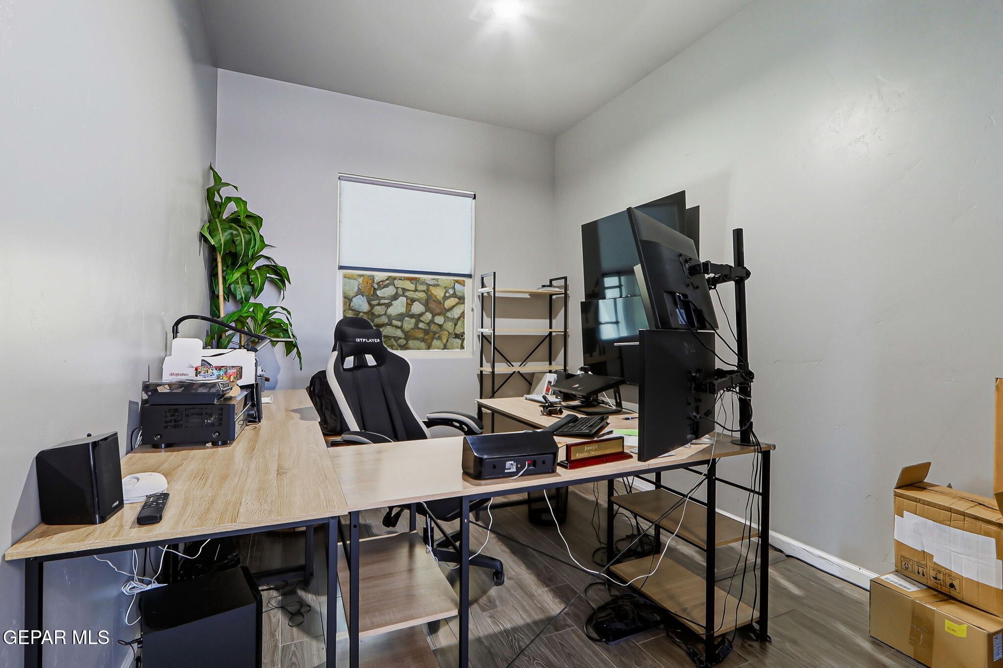 5812 Sundale Road El Paso, TX 79912 - Photo 26 of 47 a view of a workspace with furniture and wooden floor