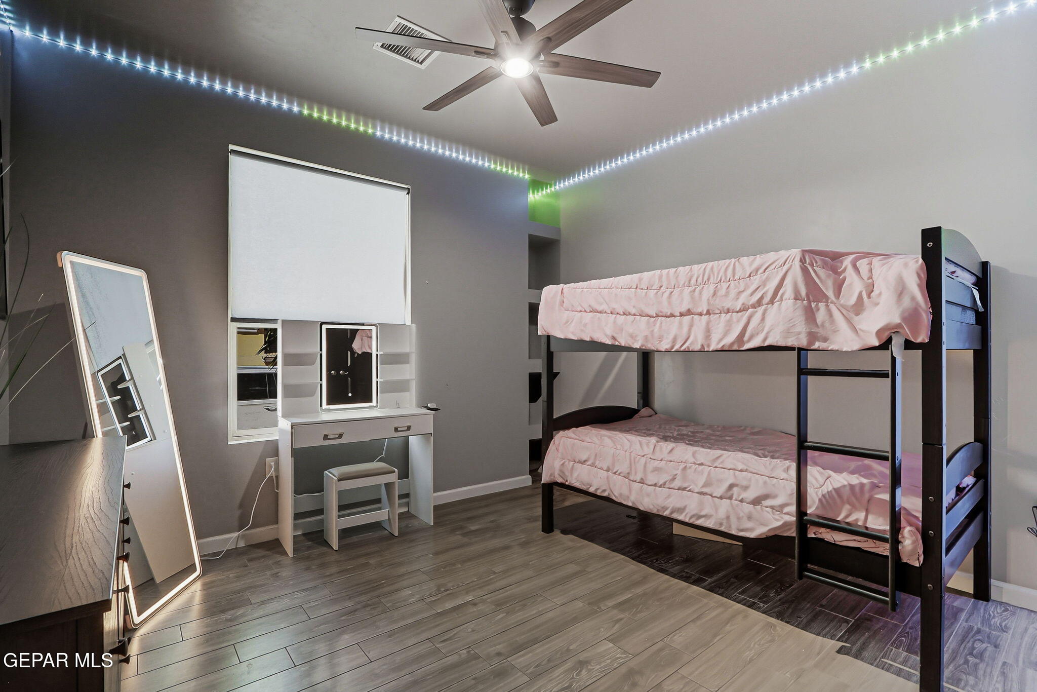 5812 Sundale Road El Paso, TX 79912 - Photo 27 of 47 a bedroom with a bed and a chandelier