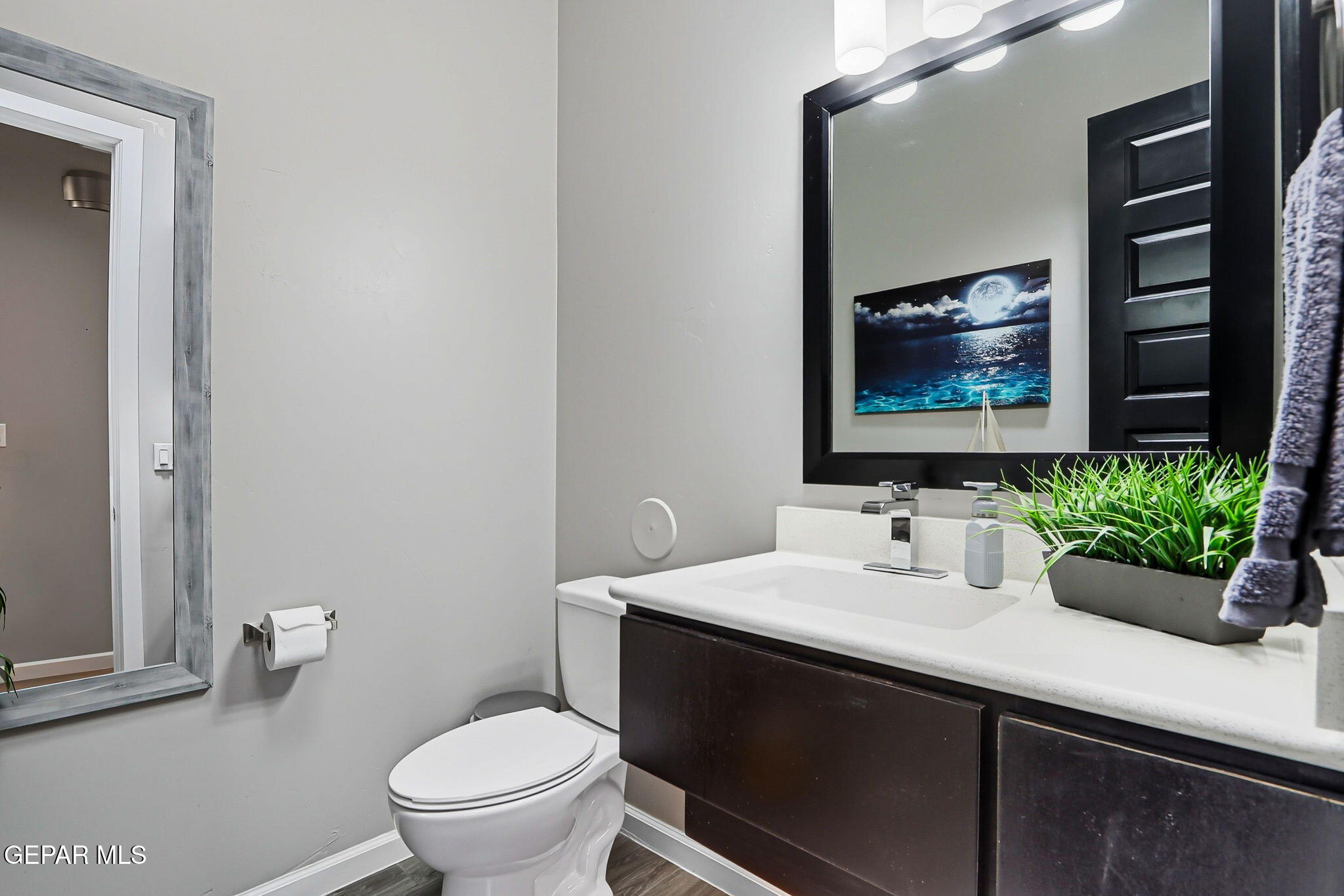 5812 Sundale Road El Paso, TX 79912 - Photo 30 of 47 a bathroom with a toilet sink and mirror