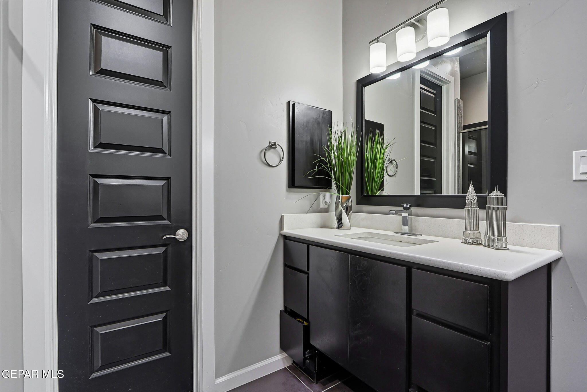 5812 Sundale Road El Paso, TX 79912 - Photo 37 of 47 a bathroom with a double vanity sink and a mirror