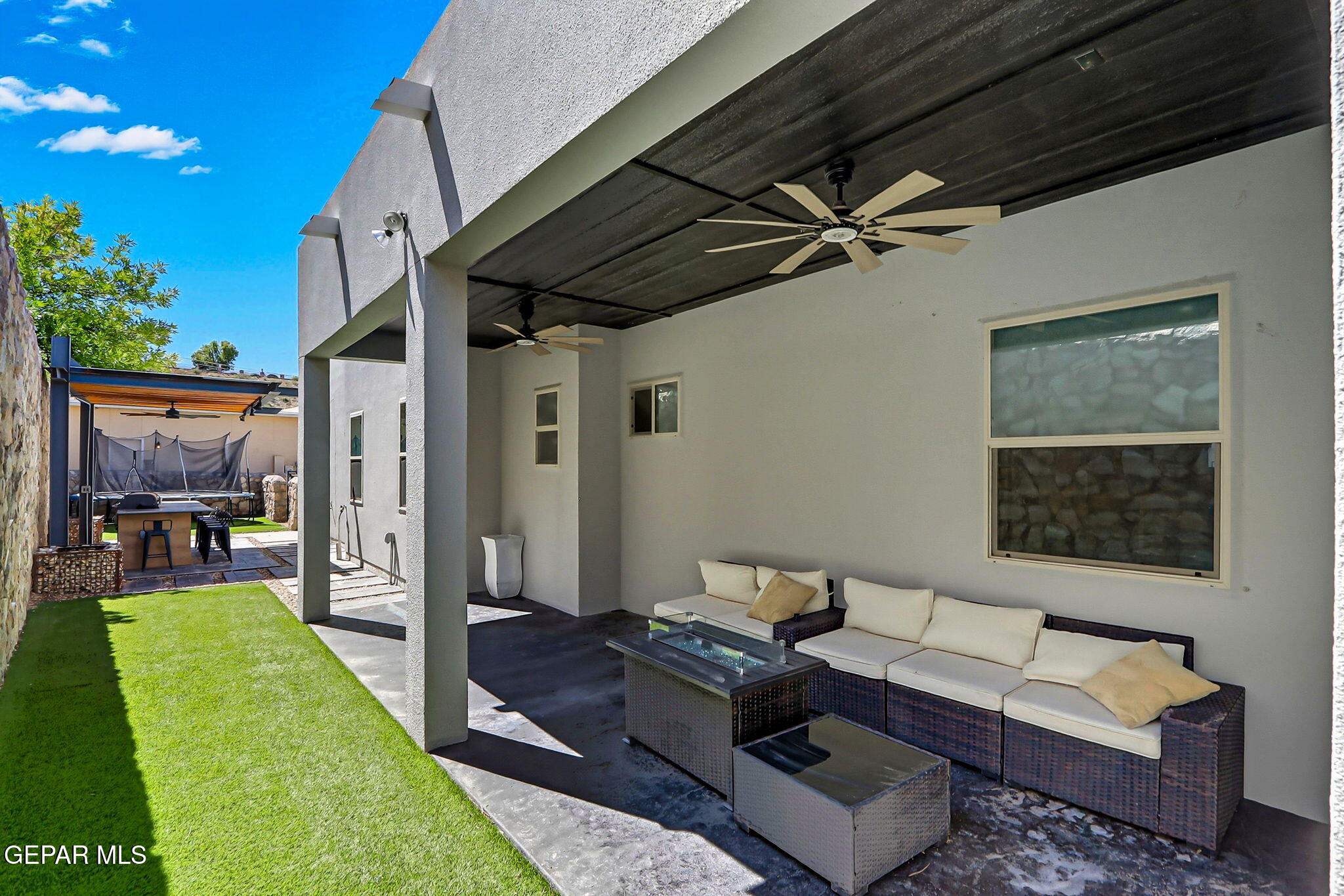 5812 Sundale Road El Paso, TX 79912 - Photo 43 of 47 a living room with furniture and a flat screen tv
