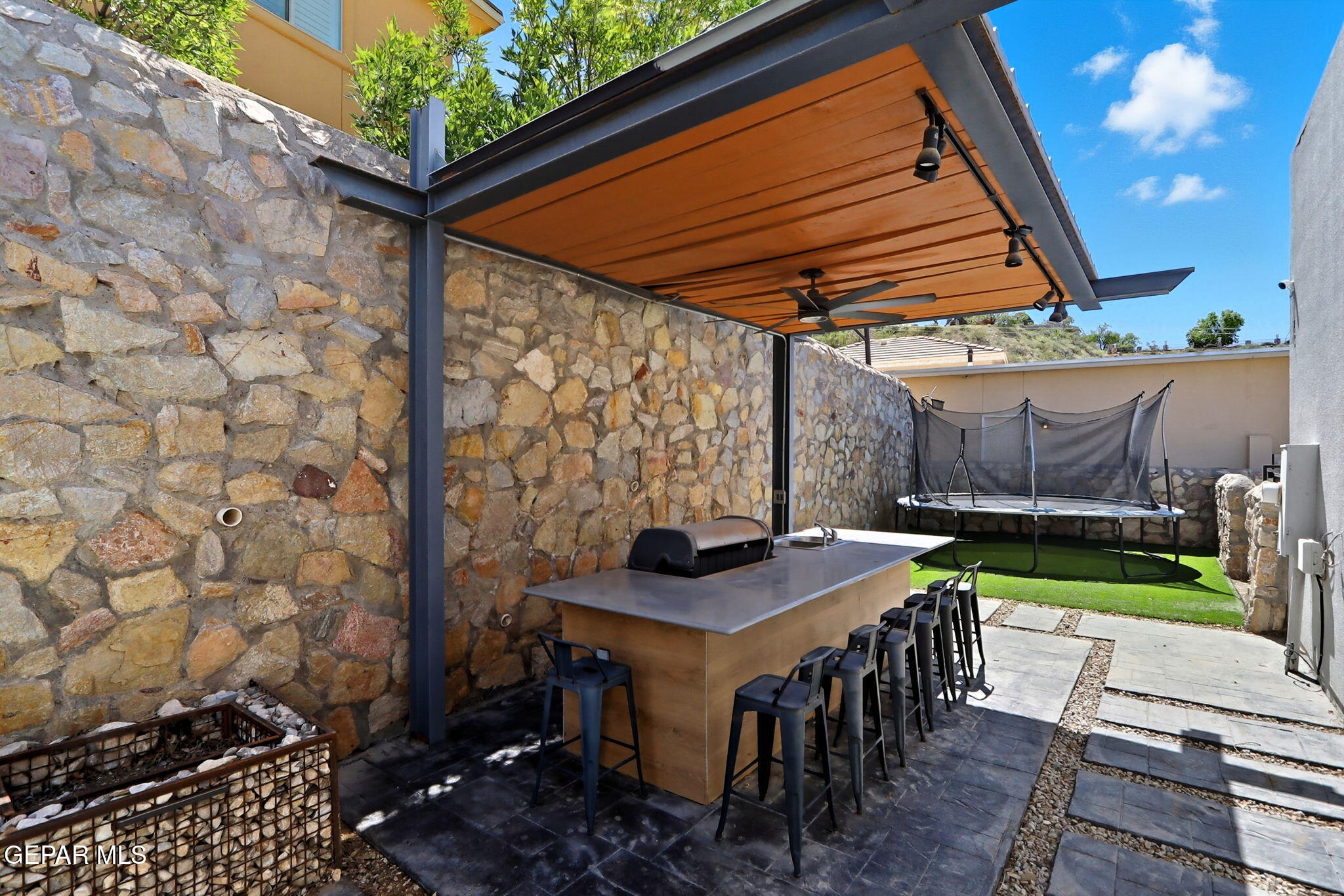 5812 Sundale Road El Paso, TX 79912 - Photo 45 of 47 a table and chairs with the table in front of it