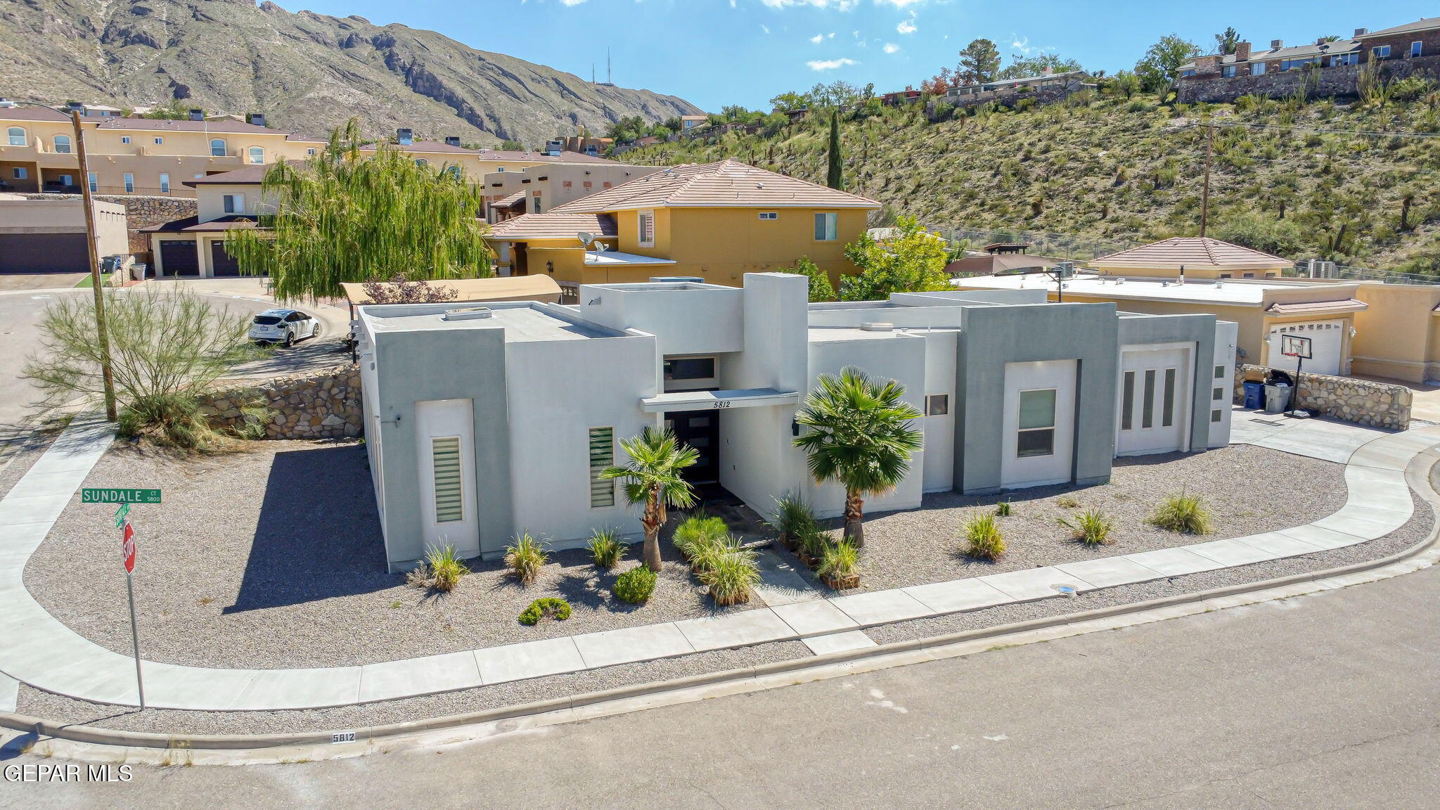 5812 Sundale Road El Paso, TX 79912 - Photo 5 of 47 an aerial view of a house with a yard and outdoor seating