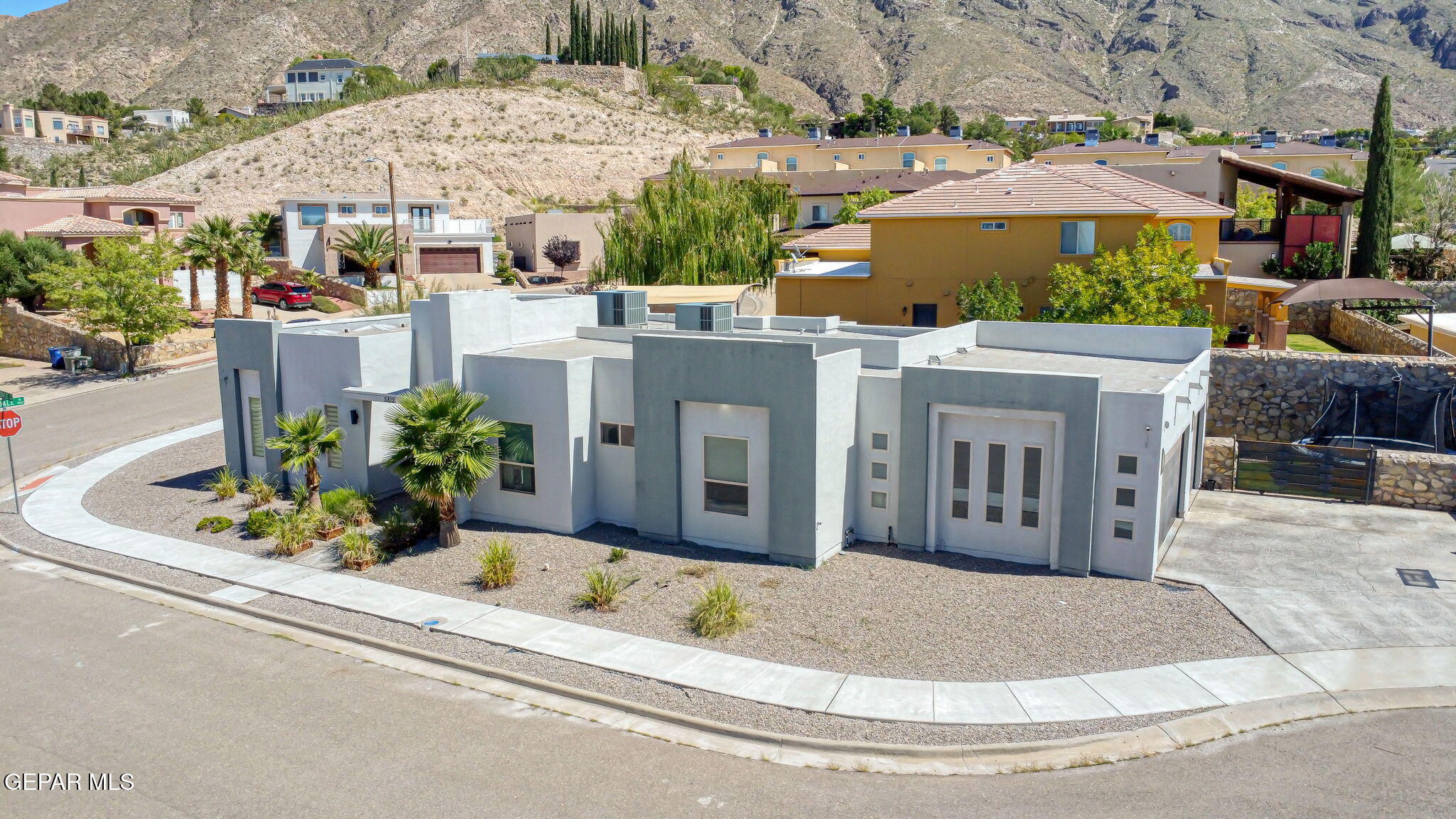 5812 Sundale Road El Paso, TX 79912 - Photo 6 of 47 a view of a white house with a yard and potted plants