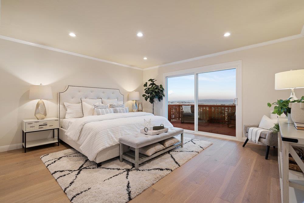 708 Morningside Drive Millbrae, CA 94030 - Photo 13 of 36 a spacious bedroom with a bed and wooden floor