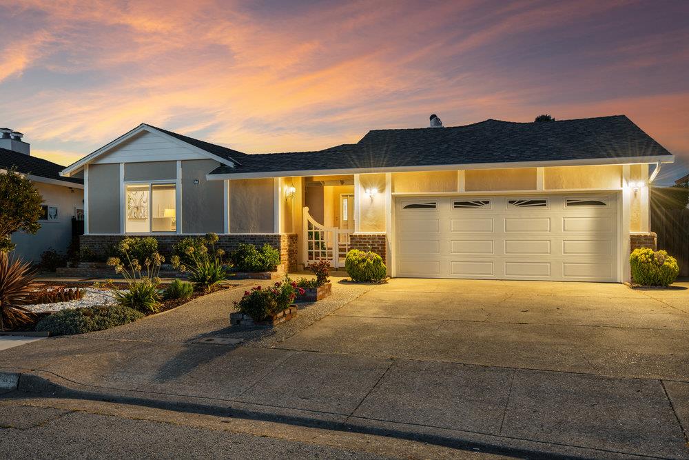 708 Morningside Drive Millbrae, CA 94030 - Photo 2 of 36 a front view of a house with a yard and garage