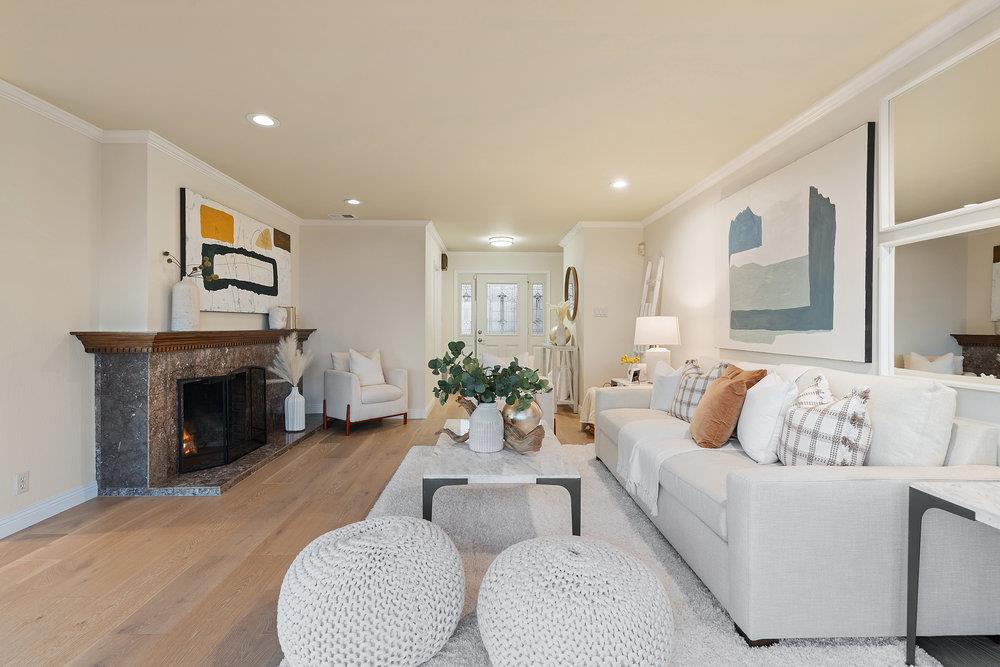 708 Morningside Drive Millbrae, CA 94030 - Photo 5 of 36 a living room with furniture and a fireplace