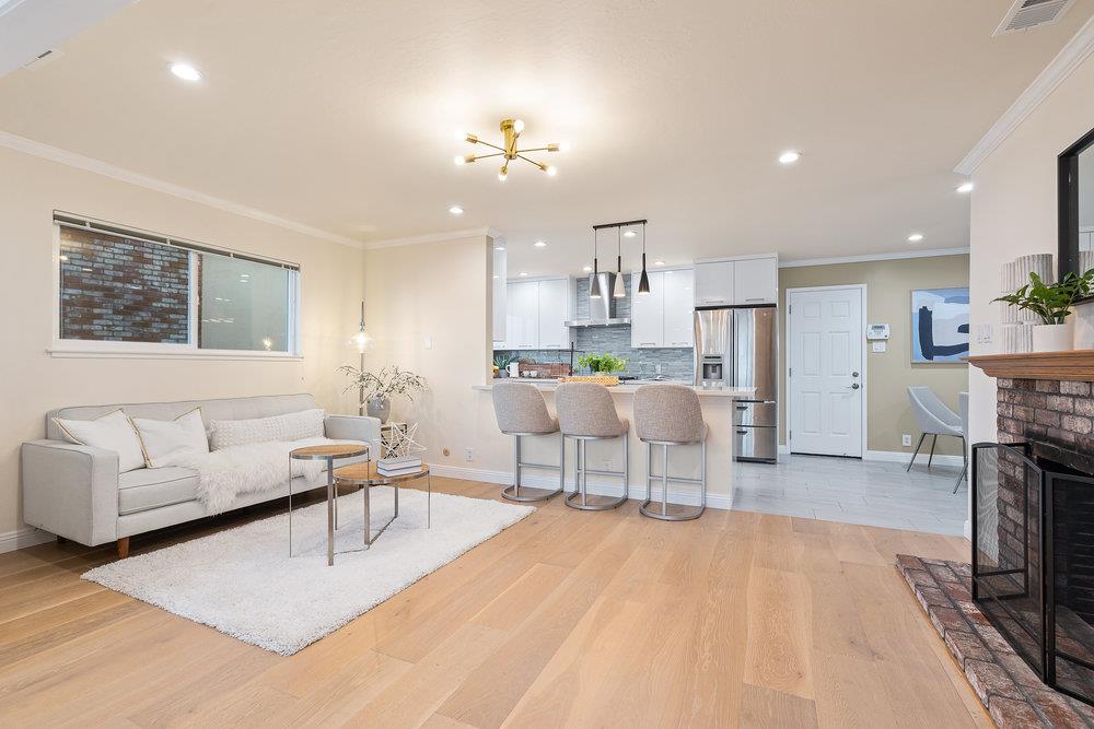 708 Morningside Drive Millbrae, CA 94030 - Photo 8 of 36 a living room with furniture and a dining table with kitchen view
