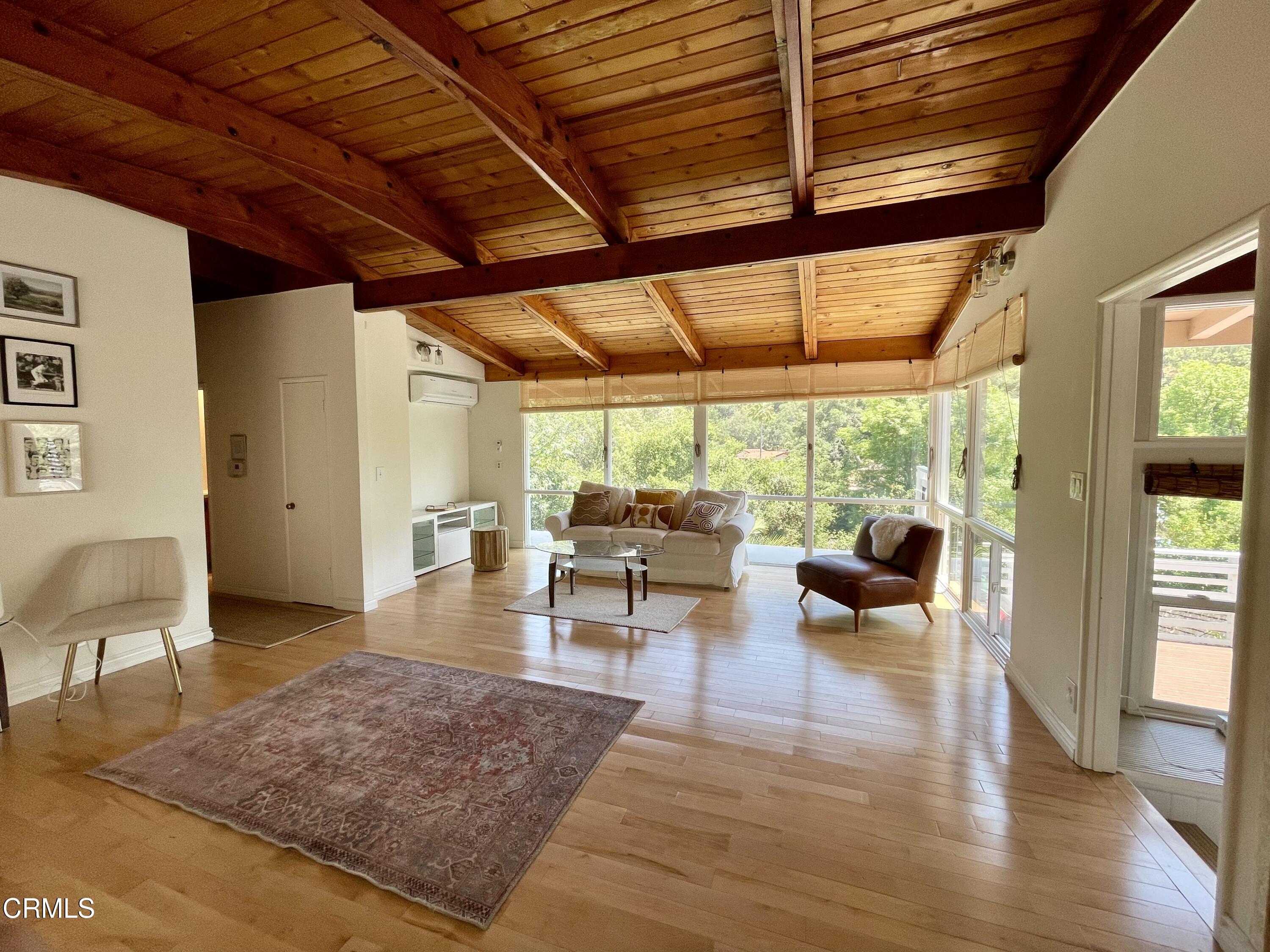 Undisclosed Address Glendale, CA 91206 - Photo 2 of 17 a living room with furniture and a wooden floor