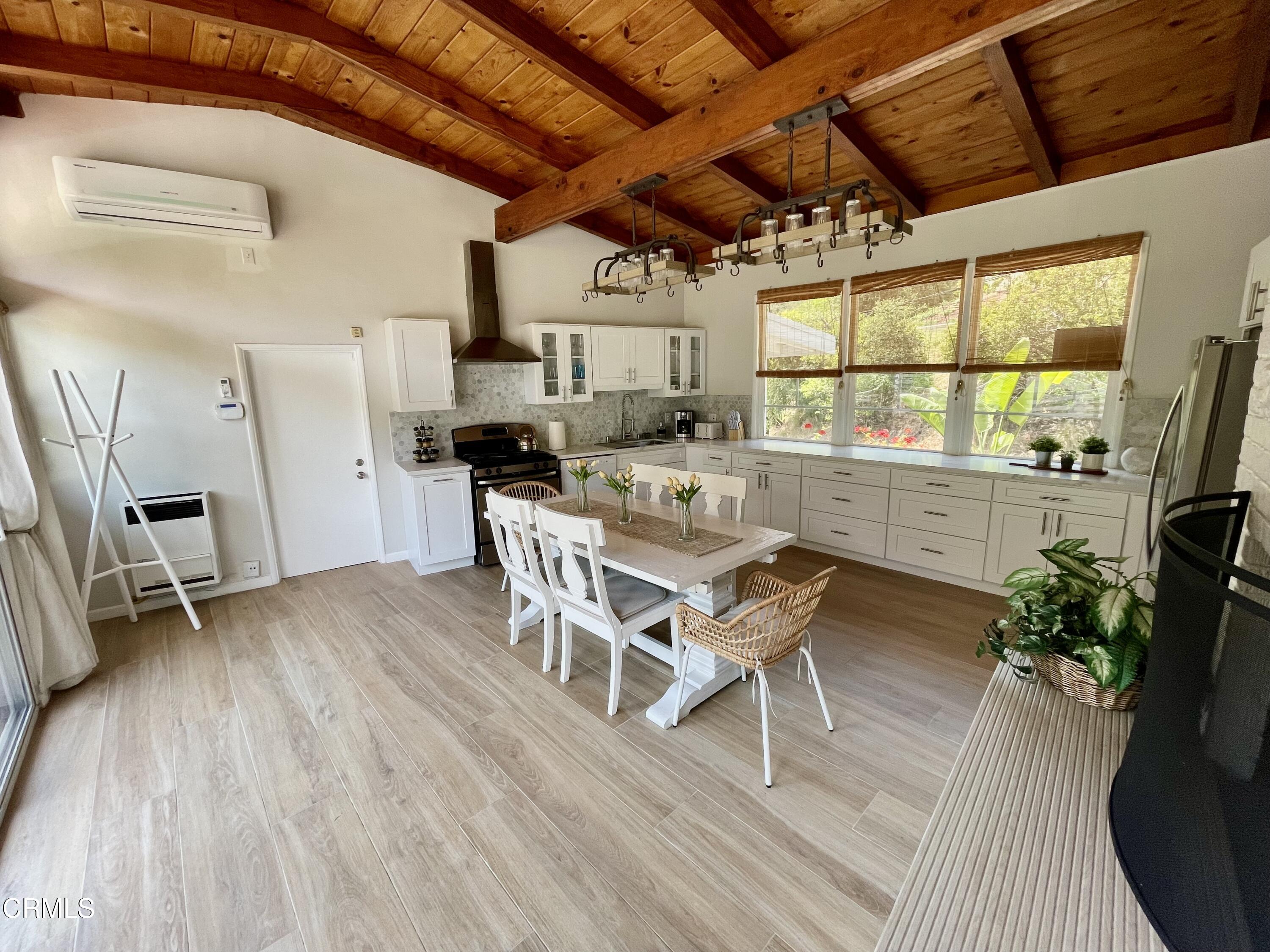 Undisclosed Address Glendale, CA 91206 - Photo 4 of 17 a dining room with furniture and wooden floor